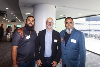 Three men standing together
