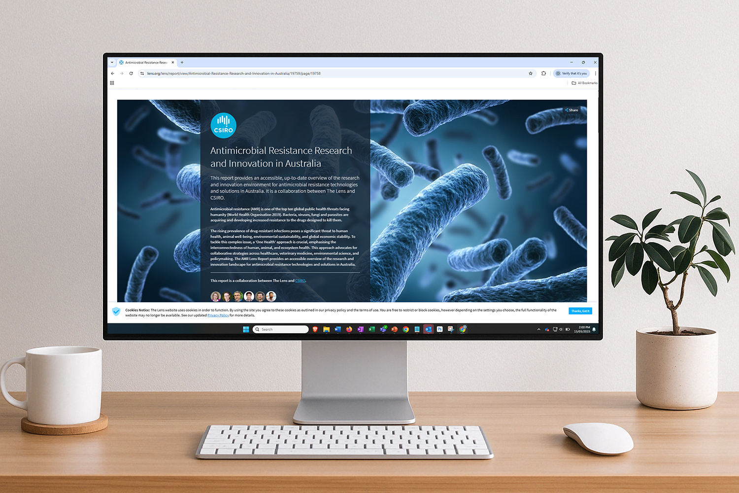 A desktop computer with the homepage of the AMR Lens Report displayed