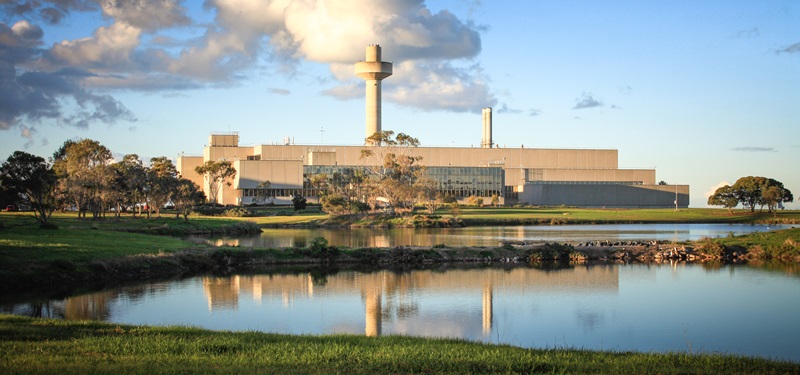 Southern view of the Australian Animal Health Laboratory, showing a lake in the foreground.