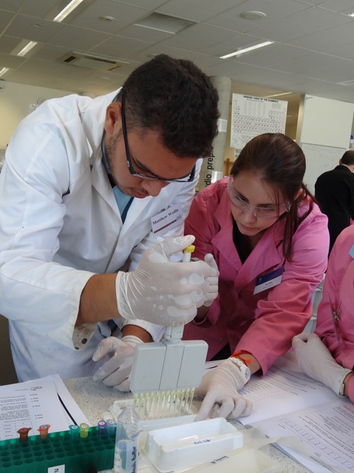 Students and scientist using hands-on scientific learning activities to improve educational outcomes