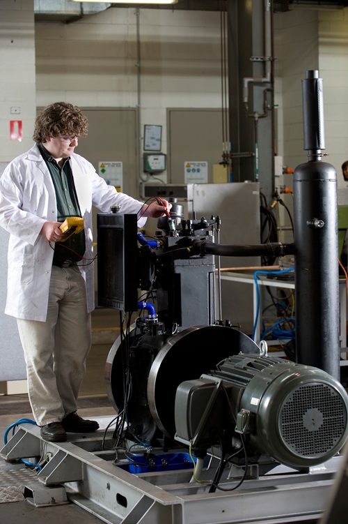 A researcher tests the Direct Injection Carbon Engine
