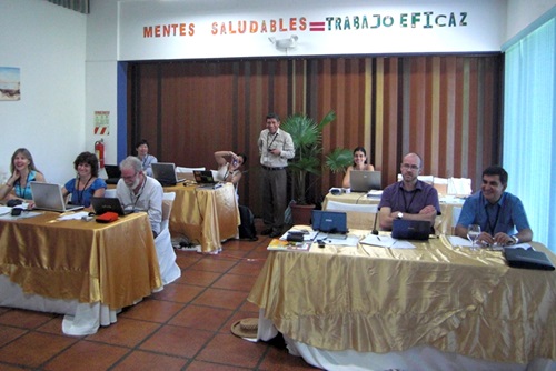 Workshop participants seated at tables.