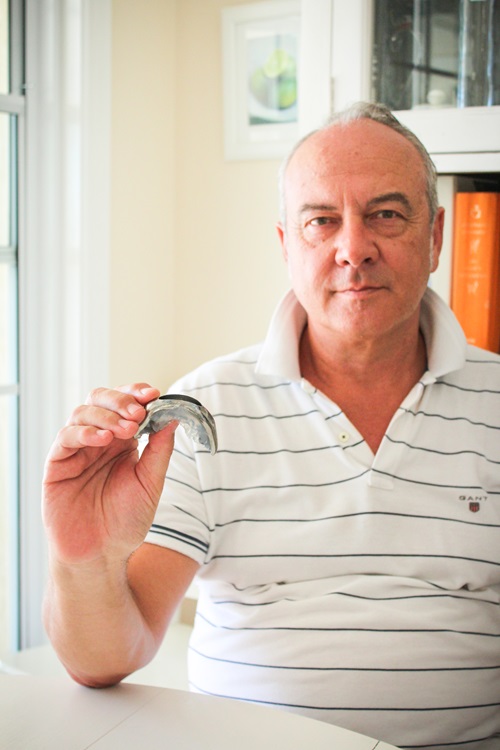 Man holding mouthguard