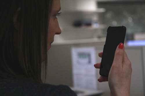 Woman holding a smartphone