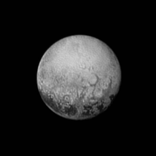 Pluto showing dark spots