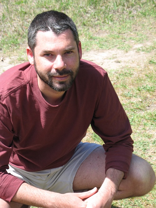 Dr Saul Cunningham crouching