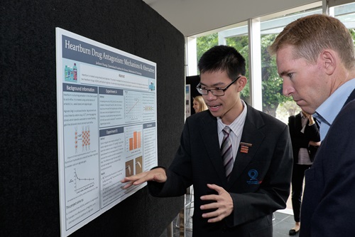 Jackson Huang explains his science poster