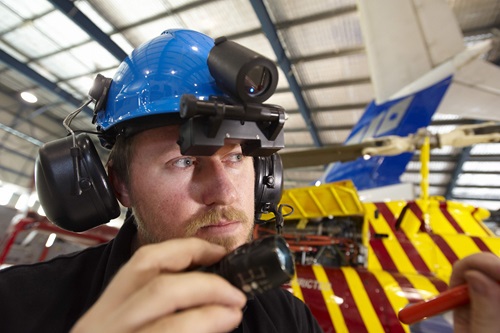 Man wearing a blue helmet ReMoTe (Remote Mobile Tele-assistance) system.