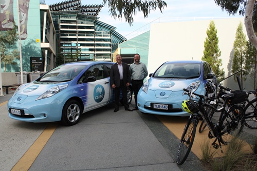 Two of CSIRO's electric cars parked outside the Discovery building.