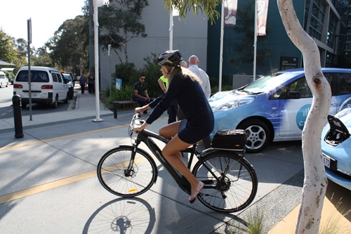 Person riding electric bike. 