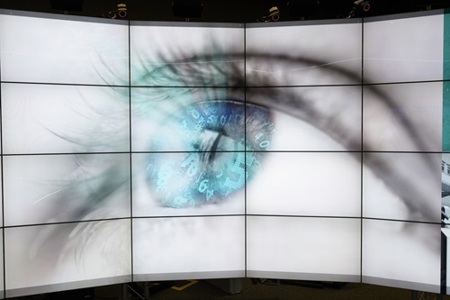 Close-up view of eye ball with electronic data superimposed over the iris and pupil.