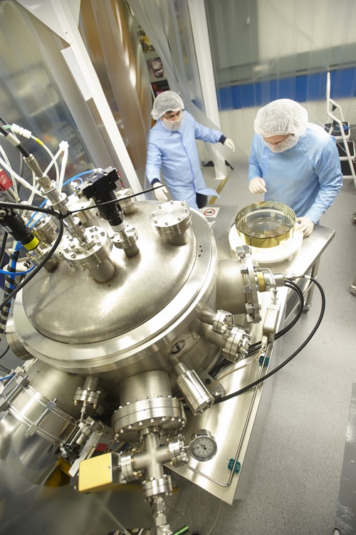 Two researchers in CSIRO's labs coating the LIGO optics.