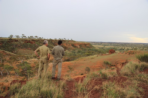 Dr Mark Thomas and Noel Schoknecht standing on escarpment looking towards the Fitzroy catchment in Western Australia.