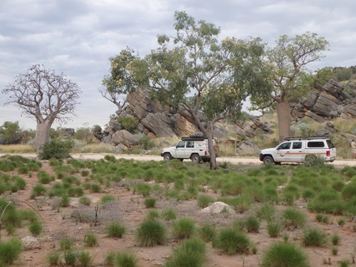 Two 4WD cars travelling along the Leopold Downs Road west of Fitzroy Crossing in Western Australia.