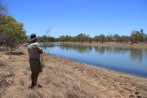 Peter R Wilson standing next to a waterhole on the Mitchell floodplain, Queensland.