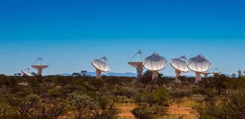 Several dishes of CSIRO’s Australian Square Kilometre Array Pathfinder as seen from distance.