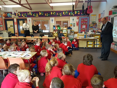Hon Arthur Sinodinos AO standing in front of a class of students from  Gundaroo primary school talking science during our STEM in Schools event.
