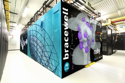 Large computer cabinet with artist's impression of banners on the outside frame including the words Bracewell, Pawsey and the CSIRO logo.
