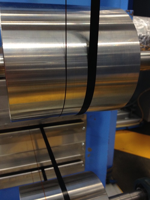 Finished carbon fibre wrapped around a drum.