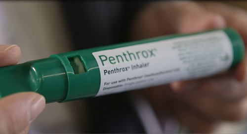 Hand holding Penthrox inhaler. 