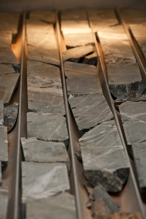 Mineral samples being analysed by a HyLogger isible and infrared light.