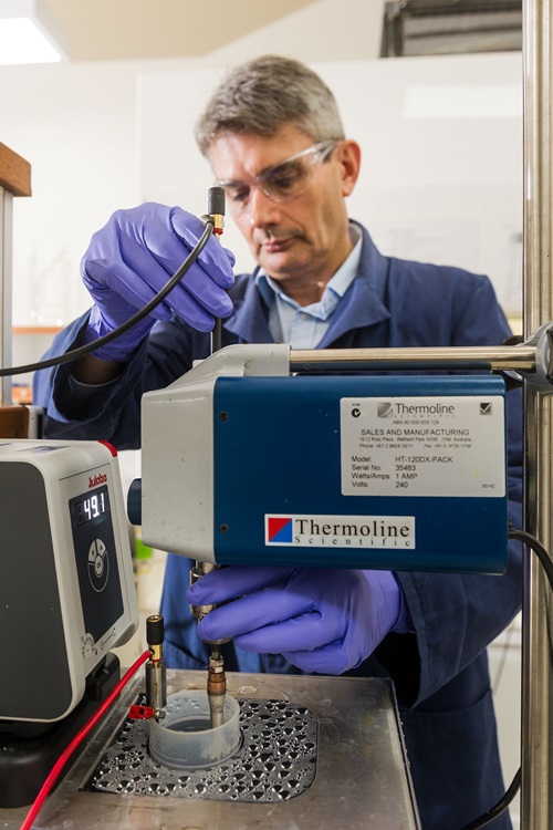 Scientist working on equipment in a lab.