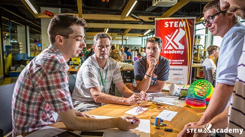 Teachers participating in a STEM X experiment.