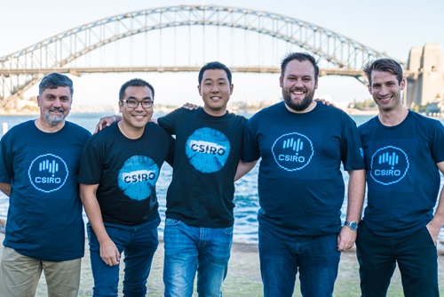 Five people standing in front of the Sydney Harbour Bridge in CSIRO t-shirts