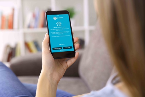 Person holding a smart phone up to look at the CSIRO Energise app.