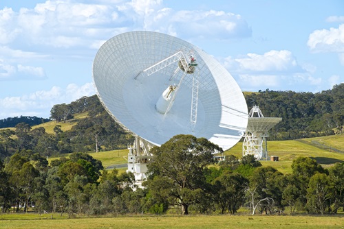 Telescopes in bushland setting. 