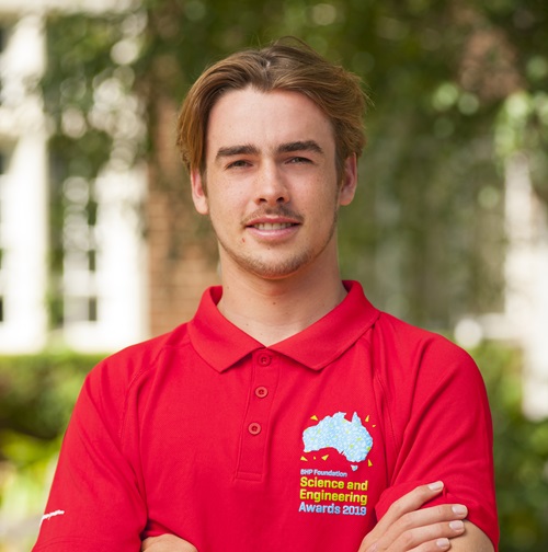 James Casey-Brown wearing a red BHP Foundation Science and Engineering Awards 2019 shirt.