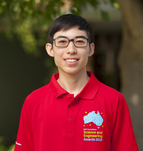 Josiah Cheng wearing a red BHP Foundation Science and Engineering Awards 2019 shirt.