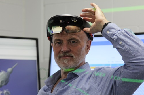 Damien Watkins wearing technology goggles from the Mixed Reality Lab.