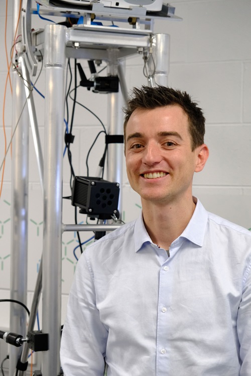 Matt Bolger standing in front of the Mixed Reality Lab technology,