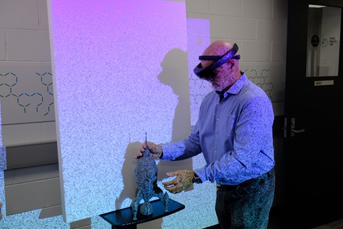 A person wearing a visor scanning an object using CSIROs patented stereo depth fusion technology.