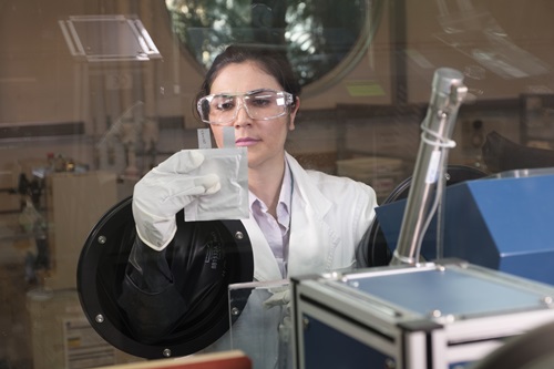 Scientist looks at batteries