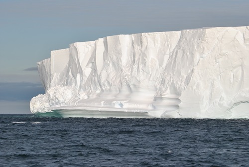 View across the water to the edge of an ice shelf. 