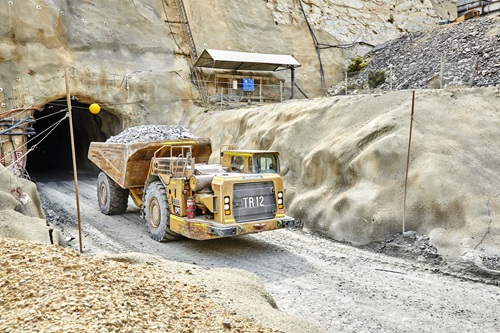 Truck drives out of a cave