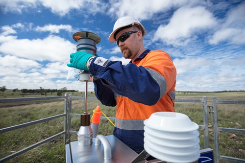 CSIRO scientist takes air quality readings at a CSG well site. 