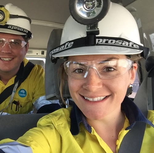 Headshot of a scientist wearing a hard hat