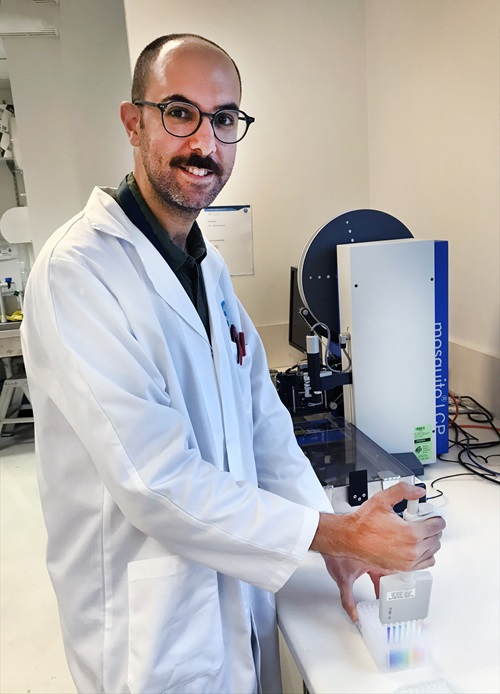 Scientist injects rainbow liquid into caps