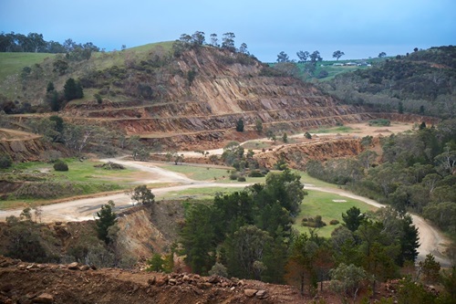 Rows are carved out of a hillside.