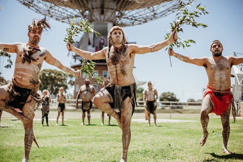 Indigenous group performing naming ceremony in front of the Parkes radio telescope. 