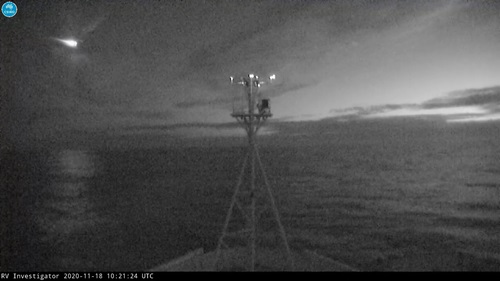 Meteor streaking across night sky filmed by on-board camera on the RV Investigator. 