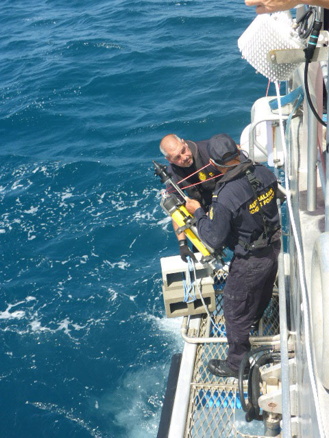 Border Force deploying hydrophone technology from a boat. 