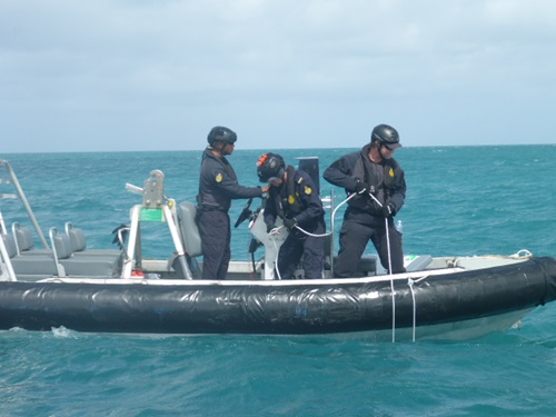 Border Force deploying hydrophone technology from a boat. 