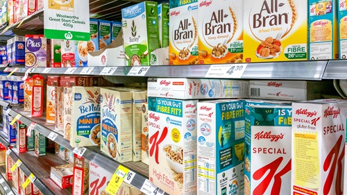 A variety of products on a supermarket shelf.