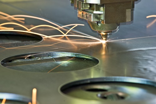 A CNC laser metal cutting tool in operation
