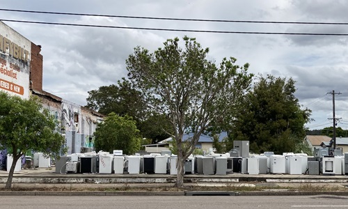 High income countries including Australia tend to have the highest material footprint and are bigger consumers. Pictured are discarded white goods on Maitland Road Mayfield, NSW. Image by Anthony Dean. 