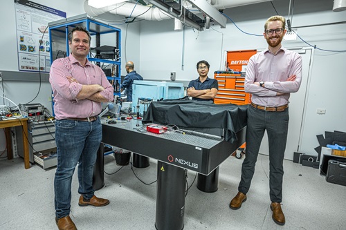 Three scientist-founders in a lab